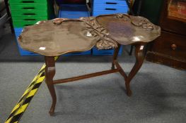 An unusual carved wood coffee table of naturalistic form with folding legs.