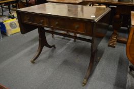 A reproduction mahogany sofa table.