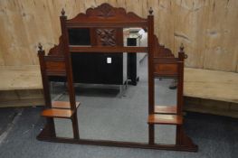 A walnut over mantle mirror.
