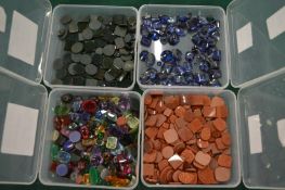 Four boxes of decorative stones.