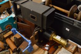 An early mahogany and brass slide lantern together with a quantity of slides.
