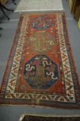 A good Persian carpet, red ground with stylised decoration 270cm x 125cm.