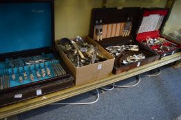 Part canteens of cutlery and a quantity of plated flatware.