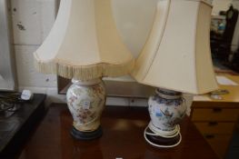 Two floral decorated pottery table lamps.