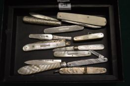 A collection of silver and mother of pearl fruit knives and similar items.