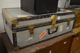 A metal storage trunk.