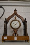 A 19th century rosewood and inlaid mantle clock, the frame with column supports.