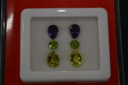 A set semi precious gem stones suitable for mounting as a pair of earrings comprising two each of