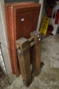 A large carpenters wooden vice and another item.