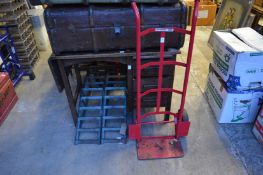 A sack barrow and a pair of car ramps.