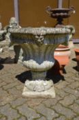 A good large reconstituted stone twin handled garden urn.