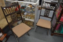 A pair of folding chairs.