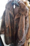 Three fur coats.