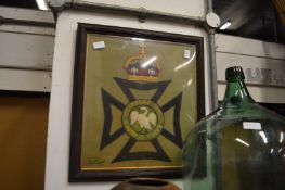 Framed and glazed military embroidery.