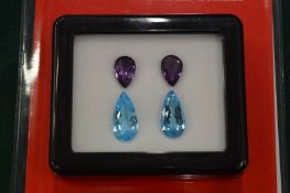 Two sets of semi precious gem stones suitable for mounting as a pair of earrings comprising two each