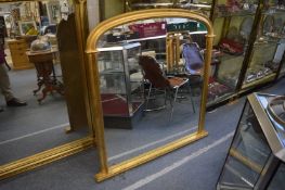 A Victorian style gilt framed overmantle mirror.
