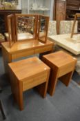 A modern walnut two drawer dressing table with mirror together with a pair of matching single drawer