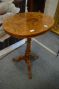 A burr walnut tripod table.