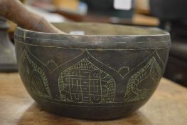 An Eastern brass singing bowl.