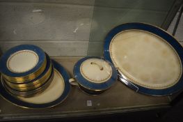 A Royal Winton part dinner service, gilt decorated with speckled blue ground border.
