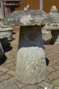 A good large staddle stone with tapering circular column support.