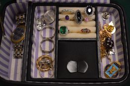 A jewellery box with contents to include numerous decorative rings etc.