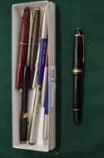 A Mont Blanc ballpoint pen and other pens.