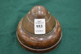 Paperweight modelled from the head of a projectile.