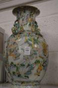 A 19th century Chinese famille verte baluster shaped vase (badly damaged).