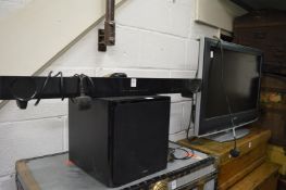 A Yamaha sound bar and subwoofer together with a Sony TV.