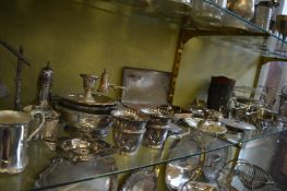 A plated table bell and other items.