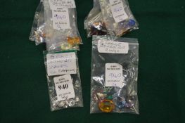 Four packets of clear and decorative stones.