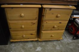 A pair of pine bedside chests.