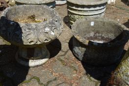 A reconstituted stone basket weave style garden planter together with a pedestal planter.