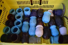 Colourful glass tea light holders.