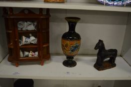 An early pottery model of a horse, a Doulton vase and other items.