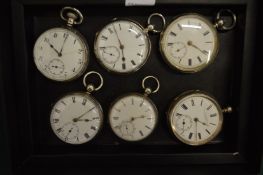 Six silver pocket watches.