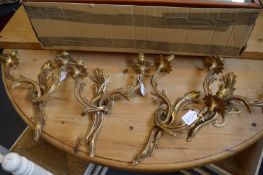 A set four ormolu twin branch wall appliques.