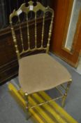 An Italian brass chair.
