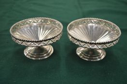 A pair of silver pedestal bonbon dishes, Birmingham 1931, retailed by Harrods.