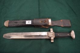 A German military knife with scabbard and leather frog.