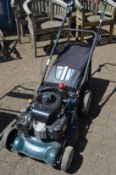 A BMC petrol rotary lawn mower converted for electric start.