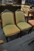 A pair of Victorian mahogany framed bedroom chairs.
