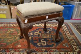 A Georgian style upholstered mahogany stool.