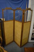 Gilt framed three panel dressing screen with part glazed panels.