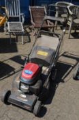 A Lawn King Honda powered petrol rotary lawn mower.