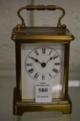 A brass carriage clock.