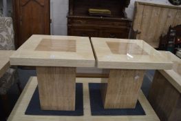 A pair of stylish lacquered marble pedestal coffee tables.