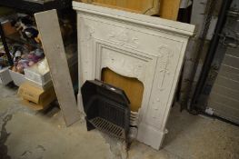 An Art Nouveau cast iron fire place.