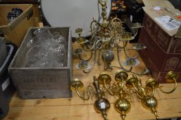 A Dutch style brass chandelier and three similar wall lights complete with etched glass shades.
